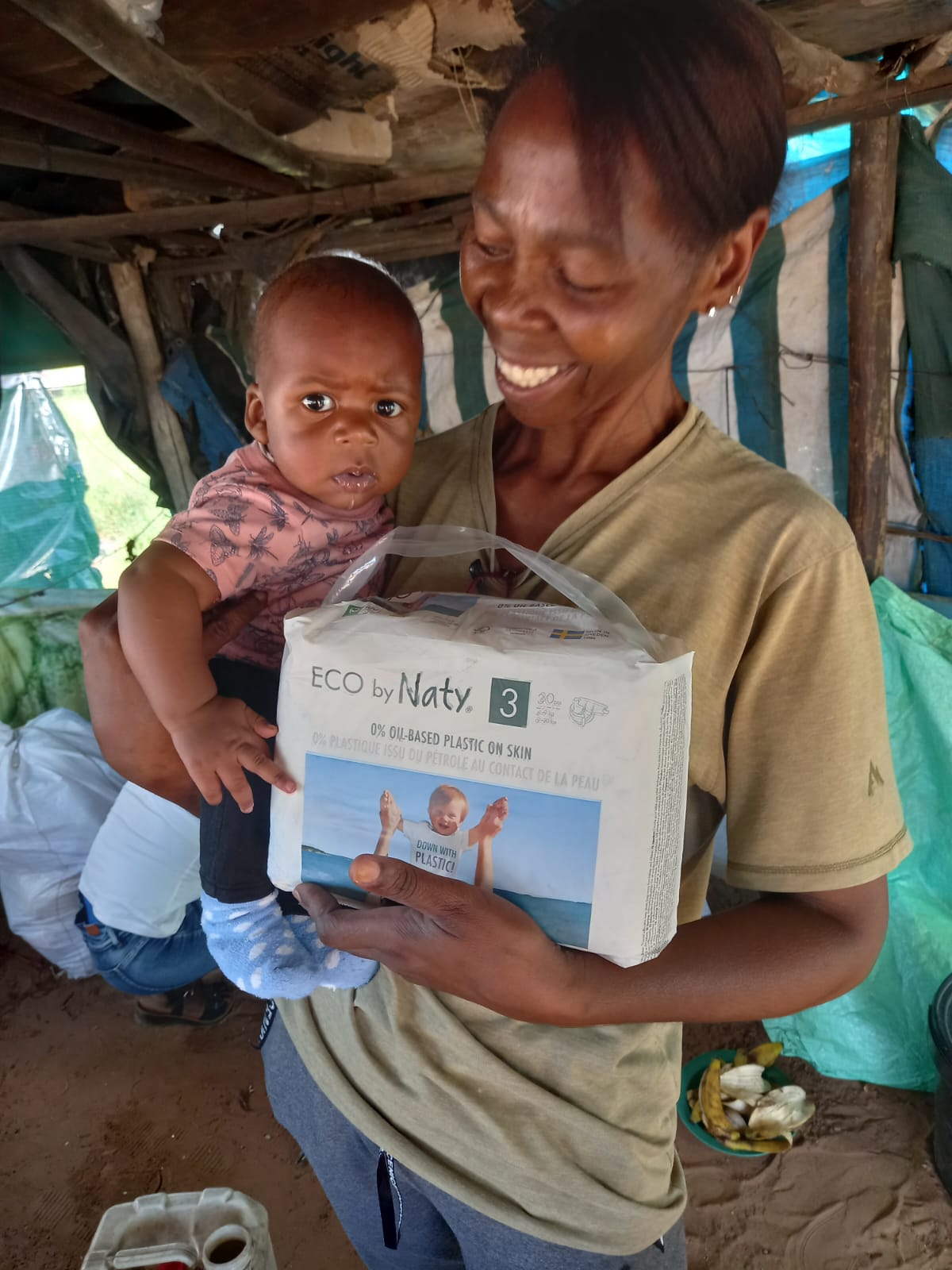 Sister Grace donating nappies for a baby born to a teenager mother